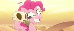 Size: 1920x804 | Tagged: safe, derpibooru import, screencap, pinkie pie, earth pony, insect, pony, my little pony: the movie, arthropod, bone, bone dry desert, crazy face, crazy smile, creepy crawlies, dead, desert, desert sun madness, exhausted, faic, insanity, messy mane, skeleton, skull, smiling, sweat, sweatdrop, tired, wide eyes, you know for kids