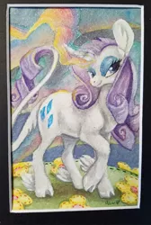 Size: 499x744 | Tagged: safe, artist:sparkynekomi, derpibooru import, rarity, classical unicorn, pony, unicorn, big ears, cloven hooves, curved horn, female, flower, glowing horn, leonine tail, mare, solo, traditional art, unshorn fetlocks, watercolor painting