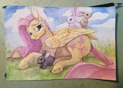 Size: 576x413 | Tagged: safe, artist:sparkynekomi, derpibooru import, fluttershy, pegasus, pony, rabbit, female, mare, solo, traditional art, underhoof, watercolor painting