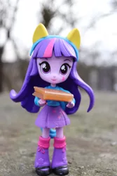 Size: 4000x6000 | Tagged: safe, artist:artofmagicpoland, derpibooru import, twilight sparkle, equestria girls, book, carrying, clothes, doll, equestria girls minis, eqventures of the minis, female, holding, leg warmers, offering, secrets, shoes, skirt, solo, sweater, toy