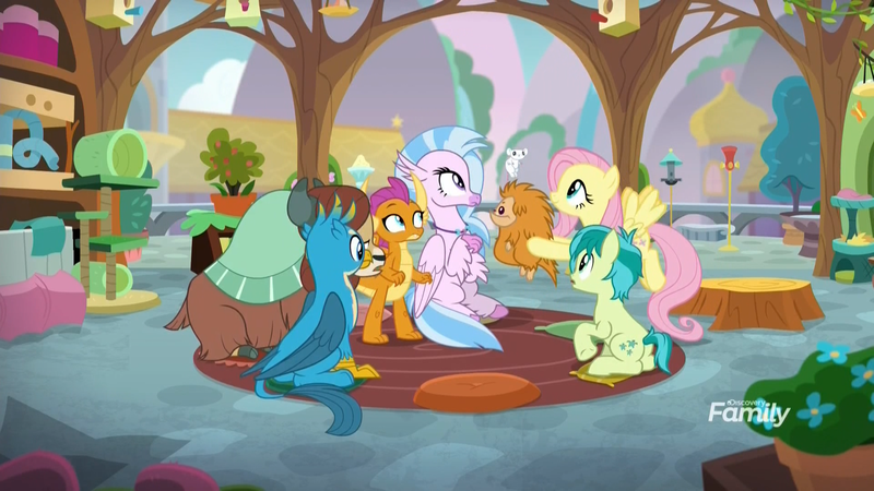 Size: 1920x1080 | Tagged: safe, derpibooru import, screencap, fluttershy, gallus, ocellus, sandbar, silverstream, smolder, yona, changedling, changeling, classical hippogriff, dragon, earth pony, gryphon, hippogriff, mouse, pony, pukwudgie, yak, school daze, bird feeder, bird house, cat tower, classroom, disguise, disguised changeling, female, habitrail, male, potted plant, school of friendship, sitting, student six, teenager