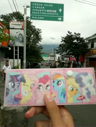 Size: 3096x4128 | Tagged: safe, derpibooru import, applejack, fluttershy, pinkie pie, rainbow dash, rarity, twilight sparkle, twilight sparkle (alicorn), alicorn, pony, indonesia, irl, mane six, pencil case, photo, ponies around the world, real life background, road sign, surabaya