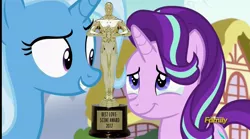 Size: 2548x1420 | Tagged: safe, derpibooru import, edit, edited screencap, screencap, starlight glimmer, trixie, all bottled up, season 7, award, cropped, crying, discovery family logo, female, get, index get, lesbian, love, oscar, ponyville, shipping, startrix, tears of joy, trophy