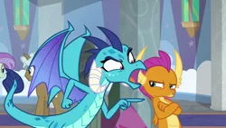 Size: 1280x720 | Tagged: safe, derpibooru import, screencap, clever musings, princess ember, smolder, violet twirl, dragon, pony, school daze, angry, background pony, dragoness, duo focus, female, friendship student, leaning, open mouth, pointing, sulking, teenaged dragon