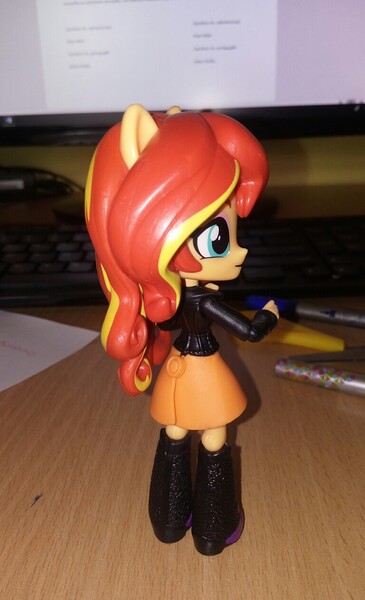 Size: 768x1262 | Tagged: safe, artist:artofmagicpoland, derpibooru import, sunset shimmer, equestria girls, boots, clothes, doll, equestria girls minis, jacket, leather jacket, looking at you, phone, pinup, sexy, shoes, skirt, sultry pose, toy