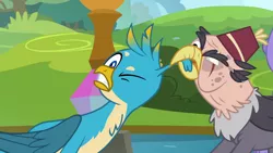 Size: 1280x720 | Tagged: safe, derpibooru import, screencap, gallus, grampa gruff, gryphon, school daze, blind eye, ear pull, eye scar, fez, hat, one eye closed, ouch, pulling, scar