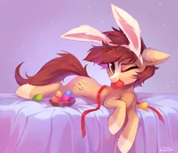 Size: 1811x1558 | Tagged: safe, artist:ramiras, artist:share dast, derpibooru import, oc, oc:bead trail, unofficial characters only, earth pony, pony, bed, bunny ears, chest fluff, ear fluff, easter, easter bunny, easter egg, egg, female, floppy ears, fluffy, holiday, hoof fluff, leg fluff, looking at you, mare, mouth hold, one eye closed, prone, ribbon, rule 63, socks (coat marking), solo, ych result