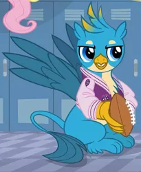 Size: 599x731 | Tagged: safe, derpibooru import, screencap, fluttershy, gallus, gryphon, season 8, american football, claws, clothes, cropped, jacket, letterman jacket, male, paws, solo focus, sports, varsity jacket, wings