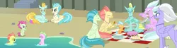 Size: 3990x1080 | Tagged: baby seaponies (g4), background hippogriff, background sea pony, beach, beach ball, bowl, bread, cake, classical hippogriff, cliff, coexist, cookie, cup, cupcake, derpibooru import, drums, edit, eyes closed, fledgeling, food, hippogriff, jaffa cake (hippogriff), picnic, picnic blanket, plate, playing, prone, safe, screencap, seapony (g4), seashell, seaweed, sitting, surf and/or turf, unnamed character