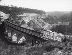 Size: 1024x776 | Tagged: artist:didgereethebrony, australia, black and white, blue mountains, bridge, derpibooru import, friendship express, grayscale, irl, lithgow, mlp in australia, monochrome, photo, railroad, railway track, safe, steam train, train, valley, zig zag railway