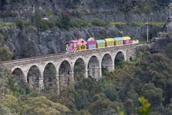 Size: 1023x683 | Tagged: artist:didgereethebrony, australia, blue mountains, bridge, derpibooru import, friendship express, irl, lithgow, mlp in australia, photo, railroad, railway track, safe, signal, train, tree, valley, zig zag railway