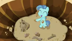 Size: 1280x720 | Tagged: safe, derpibooru import, screencap, petunia paleo, dinosaur, earth pony, pony, the fault in our cutie marks, bone, dead, dirt, eyes closed, female, filly, happy, hole, pointing, ponysaur, skeleton, skull, smiling, solo, spiny back ponysaurus