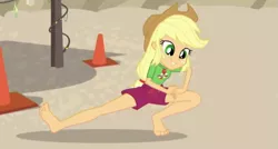 Size: 603x323 | Tagged: safe, derpibooru import, screencap, applejack, equestria girls, equestria girls series, turf war, barefoot, beach, clothes, feet, geode of super strength, legs, lifeguard, magical geodes, sand, sexy, shorts, solo, stretching, swimsuit
