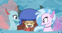 Size: 500x262 | Tagged: animated, changedling, changeling, cute, cuteling, derpibooru import, diaocelles, diastreamies, disguise, disguised changeling, gif, helmet, hug, hug sandwich, non-compete clause, ocellus, one eye closed, safe, screencap, seaponified, seapony (g4), seapony ocellus, silverstream, smiling, species swap, squishy cheeks, trio, water, wink, yak, yona, yonadorable