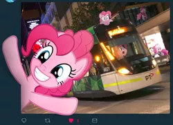 Size: 734x531 | Tagged: artist:naijiwizard, breaking the fourth wall, city, derpibooru import, edit, grin, happy, helmet, irl, like, looking at you, melbourne e-class tram, meta, multeity, photo, photoshop, pinkie clone, pinkie pie, ponies in real life, raised hooves, safe, smiling, this will end in parties, too much pink energy is dangerous, tram, twitter