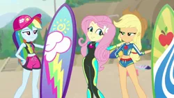 Size: 1280x720 | Tagged: safe, derpibooru import, screencap, applejack, fluttershy, rainbow dash, blue crushed, equestria girls, equestria girls series, beach, board shorts, clothes, confused, cropped, crossed arms, faic, female, freckles, geode of fauna, geode of super strength, hat, jewelry, legs, lifeguard, looking at each other, necklace, sand, shipping fuel, shorts, smiling, stairs, surfboard, swimsuit, tree, trio, trio female, wetsuit