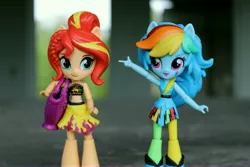 Size: 6000x4000 | Tagged: safe, artist:artofmagicpoland, derpibooru import, rainbow dash, sunset shimmer, equestria girls, equestria girls series, rainbow rocks, bag, clothes, doll, equestria girls minis, female, lesbian, looking at you, pointing, shipping, sunsetdash, swimsuit, toy