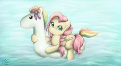 Size: 1024x557 | Tagged: safe, artist:kotyasha13, derpibooru import, fluttershy, pegasus, pony, cute, female, filly, inflatable, inflatable toy, looking at you, pool toy, riding, shyabetes, solo, swimming, water