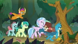 Size: 1280x720 | Tagged: safe, derpibooru import, screencap, gallus, ocellus, sandbar, silverstream, smolder, yona, changedling, changeling, classical hippogriff, gryphon, hippogriff, non-compete clause, forest, smug, student six