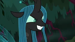 Size: 1280x720 | Tagged: changeling, changeling queen, derpibooru import, everfree forest, evil grin, fangs, female, forest, former queen chrysalis, grin, plotting, queen chrysalis, safe, screencap, smiling, solo, the mean 6