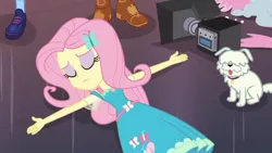 Size: 1280x720 | Tagged: safe, derpibooru import, screencap, applejack, fluttershy, sci-twi, twilight sparkle, dog, equestria girls, equestria girls series, outtakes (episode), camera, eyes closed, eyeshadow, lying, makeup, pup-pup