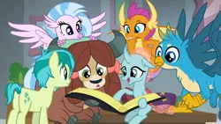 Size: 1280x720 | Tagged: safe, derpibooru import, edit, edited screencap, screencap, gallus, ocellus, sandbar, silverstream, smolder, yona, changedling, changeling, classical hippogriff, dragon, gryphon, hippogriff, nymph, yak, school daze, book, cute, diaocelles, diastreamies, dragoness, female, foal, gallabetes, male, open mouth, pony eyes, pony eyes edit, sandabetes, smiling, smolderbetes, student six, teenaged dragon, teenager, yonadorable