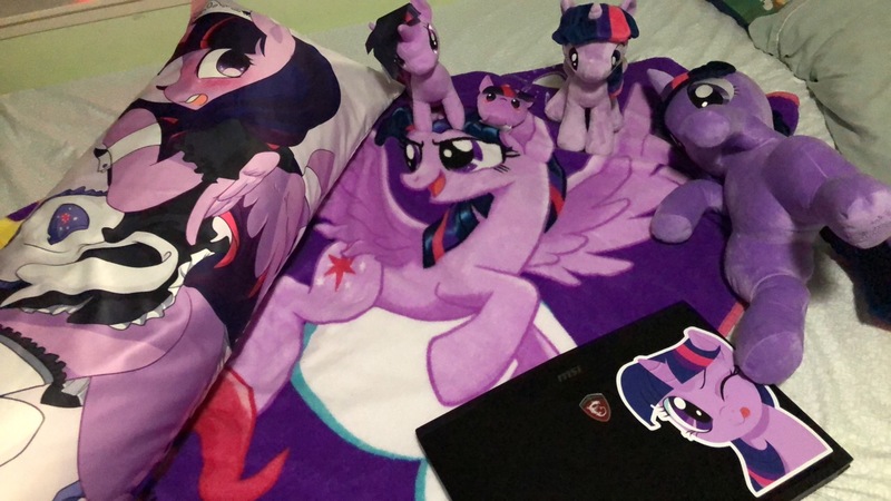 Size: 1281x721 | Tagged: safe, artist:yukandasama, derpibooru import, twilight sparkle, twilight sparkle (alicorn), alicorn, seapony (g4), bedsheets, body pillow, clothes, computer, irl, laptop computer, maid, merchandise, photo, pillow, plushie, solo, tongue out