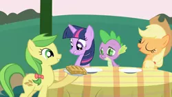 Size: 1280x720 | Tagged: safe, derpibooru import, screencap, apple fritter, applejack, spike, twilight sparkle, dragon, earth pony, pony, unicorn, friendship is magic, apple family, apple family member, apple fritter (food), female, food, licking, licking lips, lip bite, mare, quartet, table, tongue out, unicorn twilight