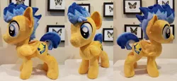 Size: 1024x469 | Tagged: safe, artist:plushypuppy, derpibooru import, flash sentry, pony, folded wings, irl, male, photo, plushie, solo, stallion, standing