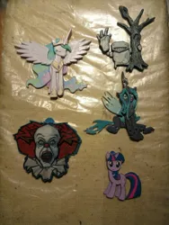 Size: 960x1280 | Tagged: safe, artist:king-franchesco, derpibooru import, princess celestia, queen chrysalis, twilight sparkle, alicorn, changeling, human, unicorn, clown, eyes closed, female, horn, irl, it, jewelry, keychain, male, open mouth, pennywise, photo, regalia, sitting, smiling, spread wings, stallion, standing, teeth, tree, wings