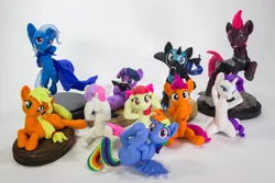 Size: 1280x853 | Tagged: safe, artist:dustysculptures, derpibooru import, apple bloom, applejack, nightmare moon, rainbow dash, rarity, scootaloo, sweetie belle, tempest shadow, twilight sparkle, alicorn, earth pony, pegasus, pony, unicorn, bronycon, bronycon 2018, arm behind head, bipedal, book, bookhorse, cape, clothes, craft, cutie mark crusaders, female, filly, hear no evil, irl, mare, on back, photo, prone, sculpture, see no evil, sitting, speak no evil, three wise monkeys, three wise ponies, trixie's cape