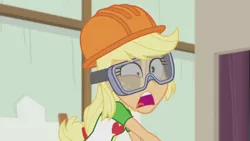 Size: 1280x720 | Tagged: safe, derpibooru import, screencap, applejack, constructive criticism, equestria girls, equestria girls series, faic, goggles, hard hat, ouch, pain, safety goggles, solo