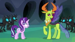 Size: 1280x720 | Tagged: safe, derpibooru import, screencap, starlight glimmer, thorax, changedling, changeling, pony, unicorn, to where and back again, changeling hive, changeling king, changeling kingdom, female, king thorax, male, mare, raised hoof