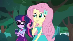 Size: 1280x720 | Tagged: safe, derpibooru import, screencap, fluttershy, sci-twi, twilight sparkle, equestria girls, equestria girls series, text support, female, geode of fauna, geode of telekinesis, glasses, hairpin, phone, ponytail, smiling, text support: fluttershy