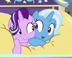 Size: 438x354 | Tagged: safe, derpibooru import, screencap, starlight glimmer, trixie, pony, unicorn, road to friendship, cheek squish, cheek to cheek, cropped, cute, diatrixes, duo, eye contact, female, friendshipping, ghastly gorge, glimmerbetes, i guess we're stuck together, inflatable, inflatable raft, looking at each other, mare, prone, raft, shipping fuel, smiling, snuggling, squished, squishy, squishy cheeks, trixie's wagon, we're friendship bound
