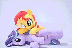 Size: 400x267 | Tagged: safe, artist:nekokevin, derpibooru import, starlight glimmer, sunset shimmer, pony, unicorn, series:nekokevin's glimmy, animated, cpr, female, gif, irl, mare, nekokevin is trying to murder us, photo, plushie, smiling, stop motion, underhoof