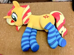 Size: 1024x768 | Tagged: safe, artist:nekokevin, derpibooru import, sunset shimmer, pony, unicorn, clothes, cute, female, irl, lying down, mare, photo, plushie, smiling, socks, solo, striped socks