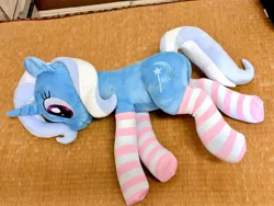 Size: 1024x768 | Tagged: safe, artist:nekokevin, derpibooru import, trixie, pony, unicorn, clothes, cute, female, irl, lying down, mare, photo, plushie, smiling, socks, solo, striped socks