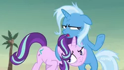 Size: 1920x1080 | Tagged: safe, derpibooru import, screencap, starlight glimmer, trixie, pony, unicorn, road to friendship, angry, annoyed, awkward moment, best friends, bipedal, cheek squish, discovery family logo, duo, duo female, female, hug, mare, messy mane, narrowed eyes, raised hoof, sarcasm, squishy cheeks, surprise hug