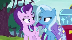 Size: 1280x720 | Tagged: safe, derpibooru import, screencap, starlight glimmer, trixie, pony, unicorn, road to friendship, cape, clothes, duo, eye contact, female, lidded eyes, looking at each other, mare, shipping fuel, tree, trixie's cape