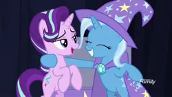Size: 1600x900 | Tagged: safe, derpibooru import, screencap, starlight glimmer, trixie, pony, unicorn, road to friendship, cape, clothes, duo, eyes closed, female, hat, lidded eyes, mare, rearing, smiling, trixie's cape, trixie's hat, wizard hat
