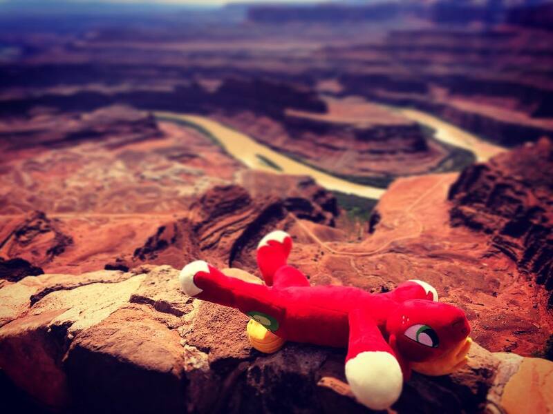 Size: 1080x810 | Tagged: big macintosh, canyon, dead horse, derpibooru import, grand canyon, irl, lying, male, on back, photo, photographer:peter new, playing dead, plushie, safe, smiling, solo, stallion, sunbathing, united states, wordplay