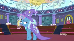 Size: 1920x1080 | Tagged: safe, derpibooru import, screencap, trixie, pony, unicorn, a matter of principals, banana, bananaphone, cape, clothes, discovery family logo, female, food, glowing horn, hat, horn, magic, mare, solo, trixie is not amused, trixie's cape, trixie's hat, unamused