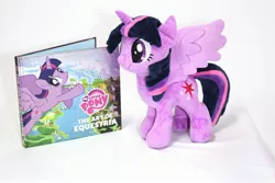 Size: 3000x2000 | Tagged: safe, artist:nekokevin, derpibooru import, twilight sparkle, twilight sparkle (alicorn), alicorn, pony, the art of equestria, book, cutie mark, female, irl, mare, photo, plushie, simple background, smiling, solo, spread wings, watermark, white background, wings