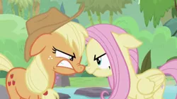 Size: 1334x750 | Tagged: safe, derpibooru import, screencap, applejack, fluttershy, earth pony, pegasus, pony, sounds of silence, angry, duo, female, mare, nose to nose, nose wrinkle, teeth