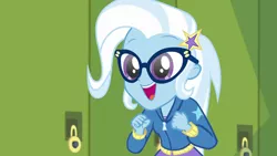 Size: 1280x720 | Tagged: safe, derpibooru import, screencap, trixie, best trends forever, equestria girls, equestria girls series, adorkable, best trends forever: twilight sparkle, canterlot high, clothes, cute, diatrixes, dork, female, glasses, hallway, hoodie, lockers, open mouth, smiling