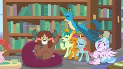 Size: 1920x1080 | Tagged: safe, derpibooru import, screencap, gallus, ocellus, sandbar, silverstream, smolder, yona, changedling, changeling, classical hippogriff, dragon, earth pony, gryphon, hippogriff, pony, yak, what lies beneath, bean bag chair, book, bookshelf, bow, cloven hooves, cup, discovery family logo, dragoness, eyes closed, female, flower, flying, grin, hair bow, jewelry, laughing, library, male, monkey swings, necklace, open mouth, raised hoof, rose, school of friendship, smiling, student six, teacup