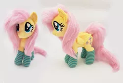 Size: 4456x3000 | Tagged: safe, artist:epicrainbowcrafts, derpibooru import, fluttershy, pony, clothes, irl, photo, plushie, socks, solo, striped socks