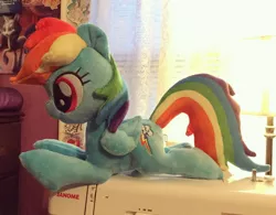 Size: 1200x934 | Tagged: safe, artist:sophieascruggs, derpibooru import, rainbow dash, pegasus, pony, female, irl, lying down, mare, photo, plushie, sewing machine, smiling, solo