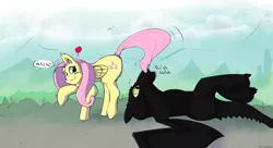 Size: 2728x1486 | Tagged: safe, artist:fuzzypones, derpibooru import, fluttershy, dragon, night fury, pegasus, pony, behaving like a cat, blush sticker, blushing, crossover, cute, female, floating heart, heart, how to train your dragon, looking back, mare, on back, playing with tail, speech bubble, toothless the dragon